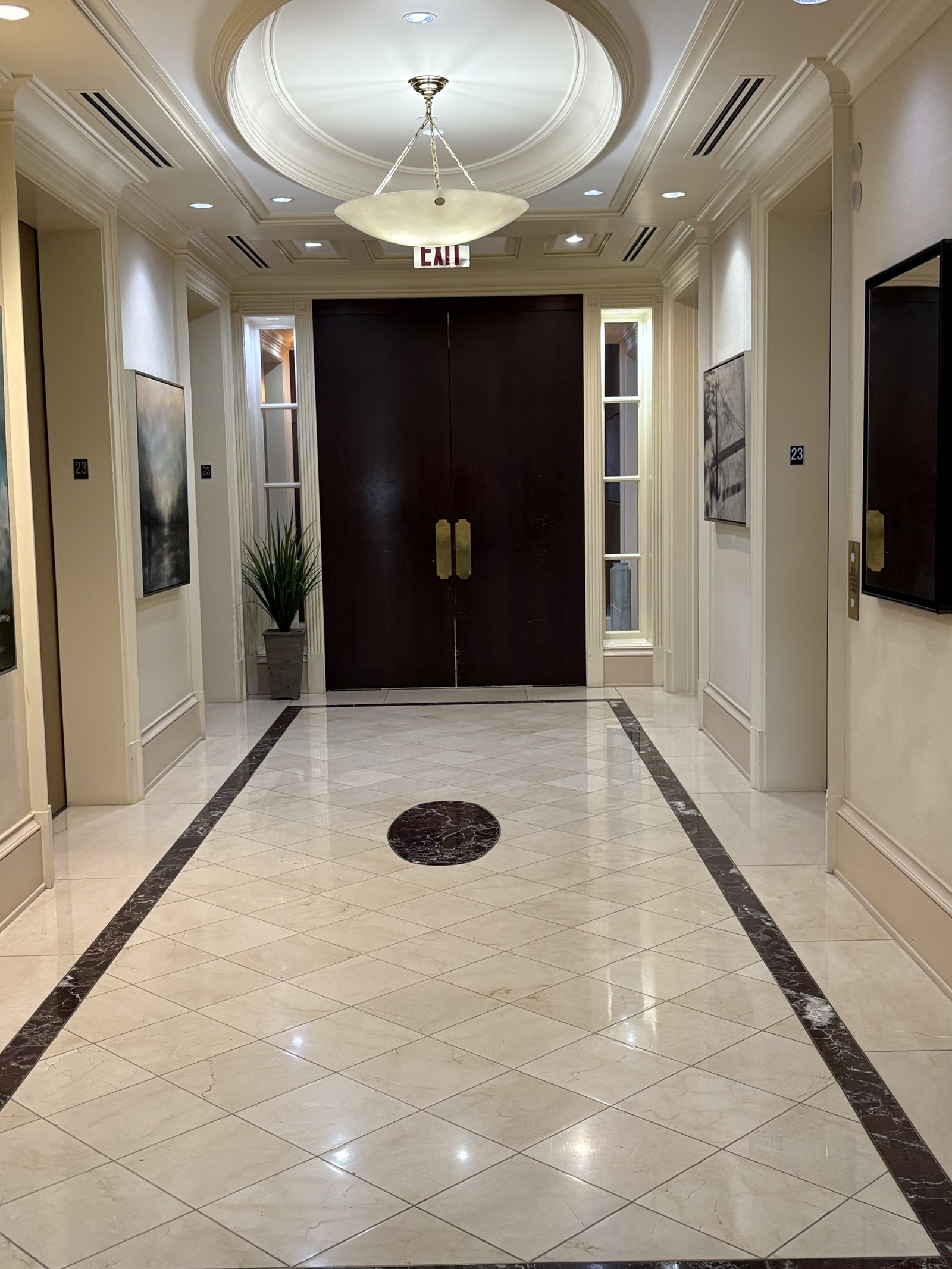 Marble elevator lobby with chandelier at One Atlantic Center