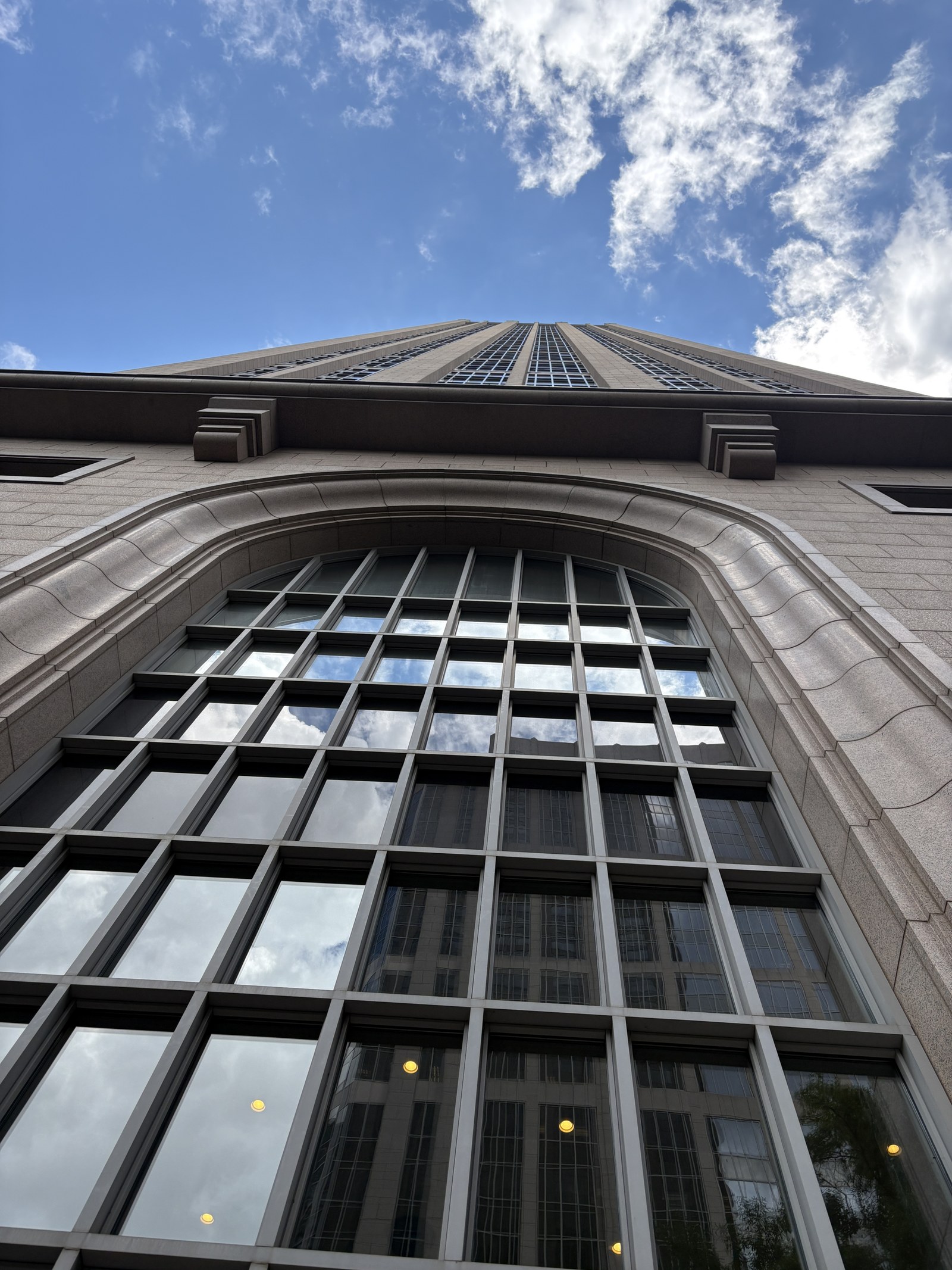 Detail of the One Atlantic Center facade and crown against the sky