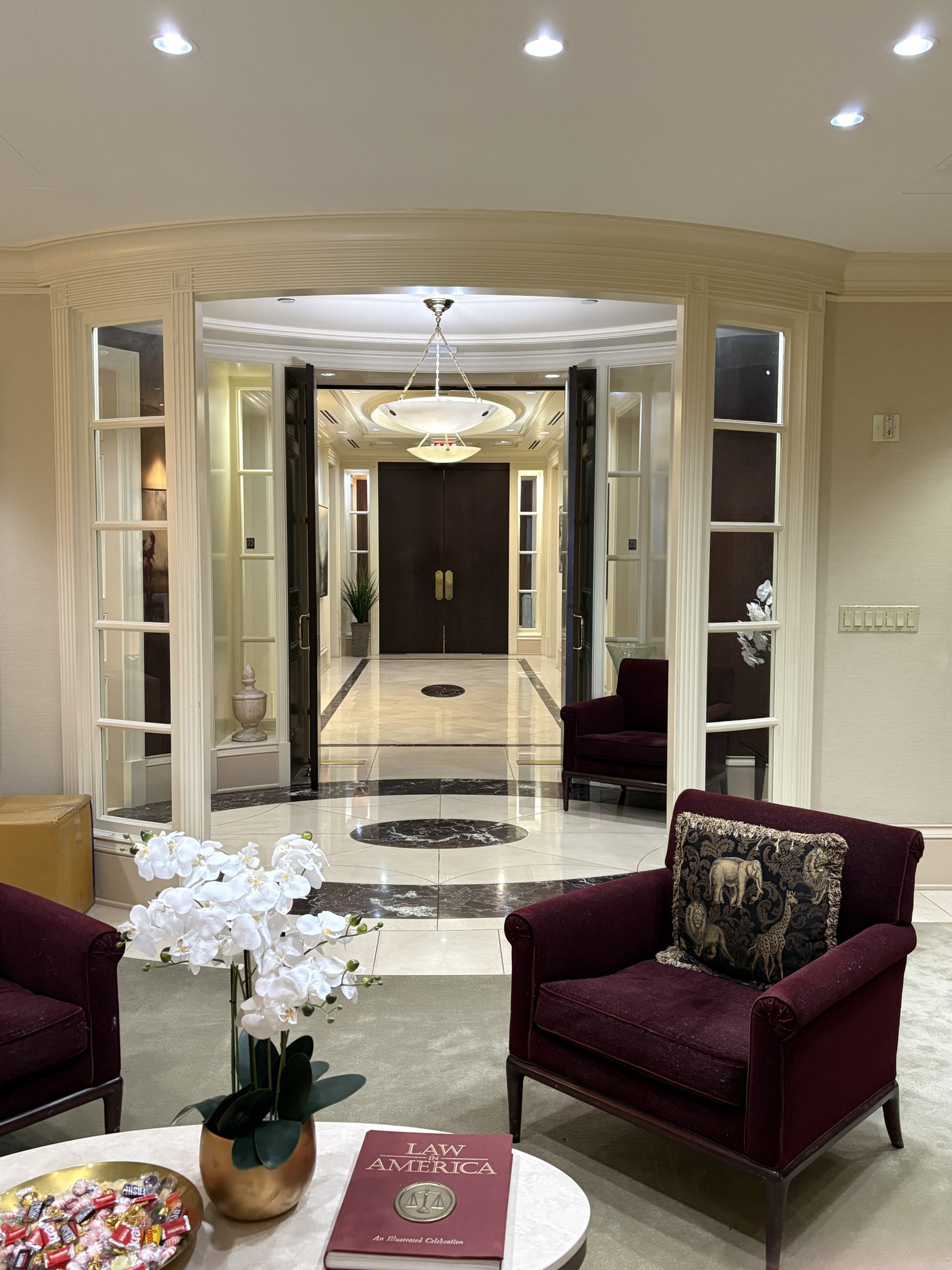 Symmetrical reception lounge with seating at One Atlantic Center